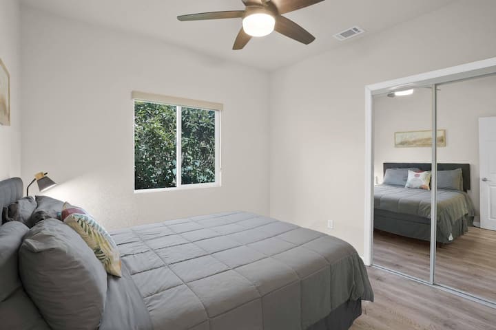 Bedroom #3 w/ pillow-top queen, ceiling fan & built-in mirror closet