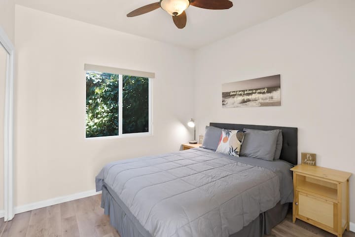 Bedroom #2 w/ pillow-top queen, ceiling fan & built-in mirror closet