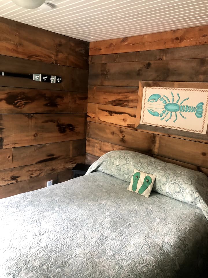 Second downstairs bedroom, off from the living room, queen bed, has sliding barn door for privacy