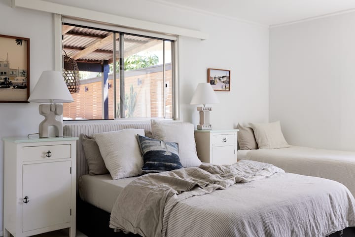 The Master Bedroom.  Queen Bed with French linen sheets and plenty of pillow.  2 kids single beds.  New Ensuite addition and Smart tv.