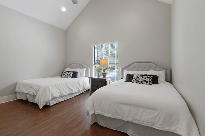 Queen beds and a large room make it easy for 4 adults in this room
