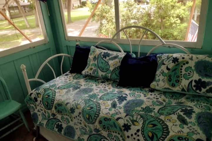 Sleeping porch- screens on 3 sides, 4 twin beds, 2 trundled, dresser, 2 chairs, carpeted
