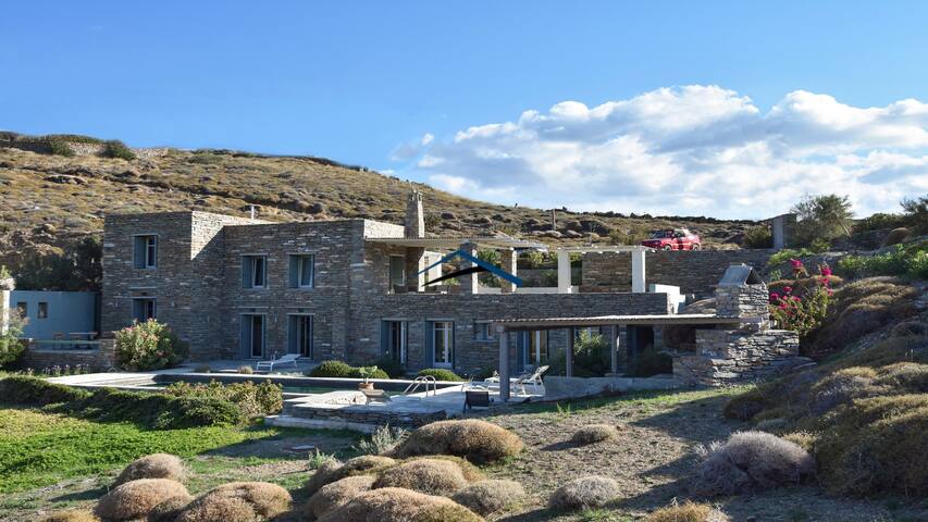 Traditional stone villa with a swimming pool.