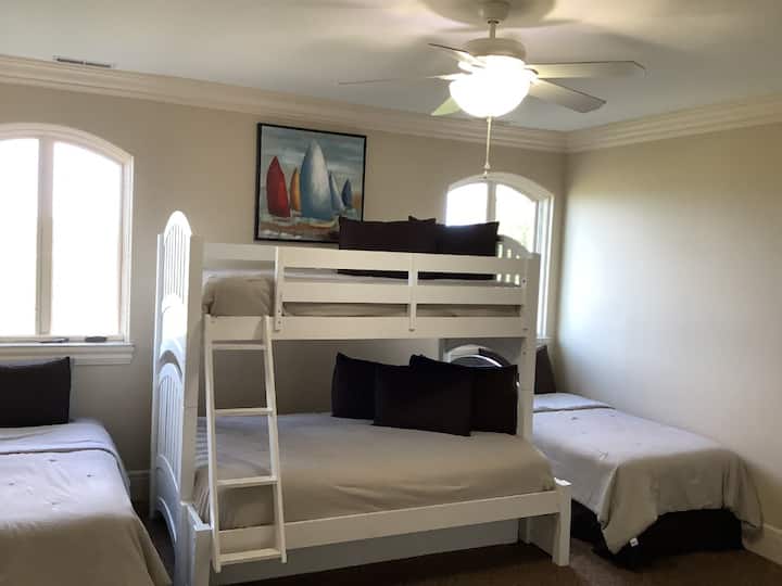 Bunkbed room sleeps 6, with trundle twin pulled out.  5 twins and one full mattress.  Has it's own private bathroom with privacy door.