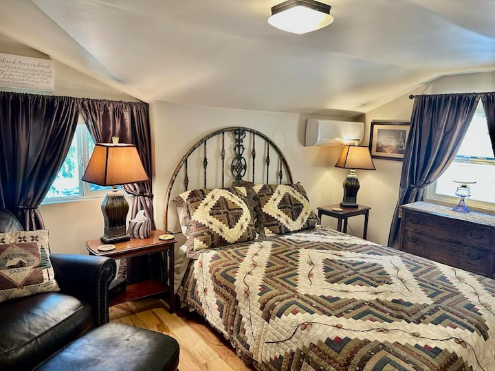 Mini -Split in the bedroom providing air conditioning or heat.  Vintage family pieces woven in for relaxing ambiance. Only bathroom is downstairs by kitchen and living room.