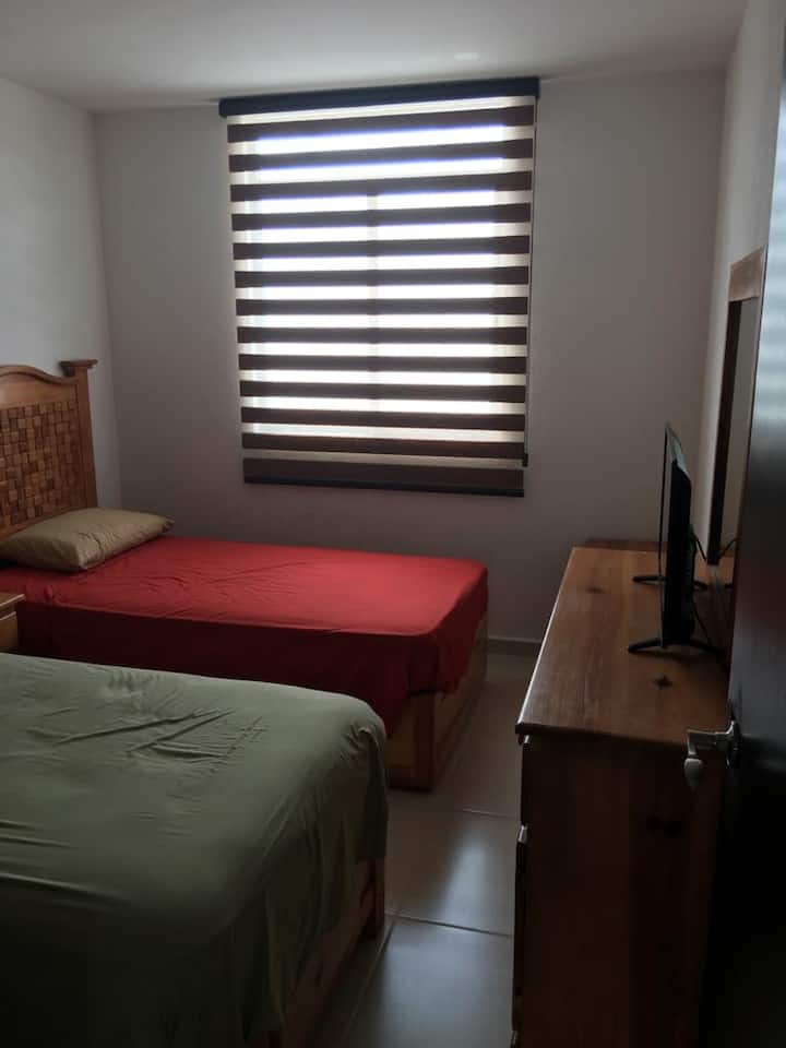 Recamara con aire acondicionado y dos camas individuales