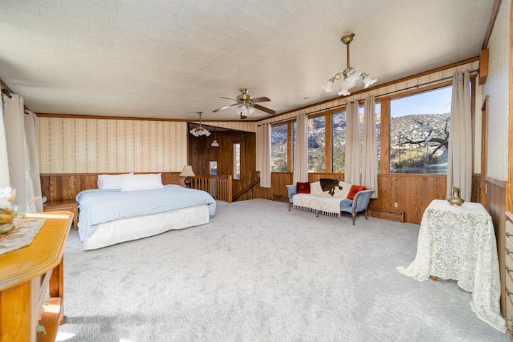 Third floor master suite, king bed, amazing view of Colorado National Monument.  Staircase coming up from second floor living room.