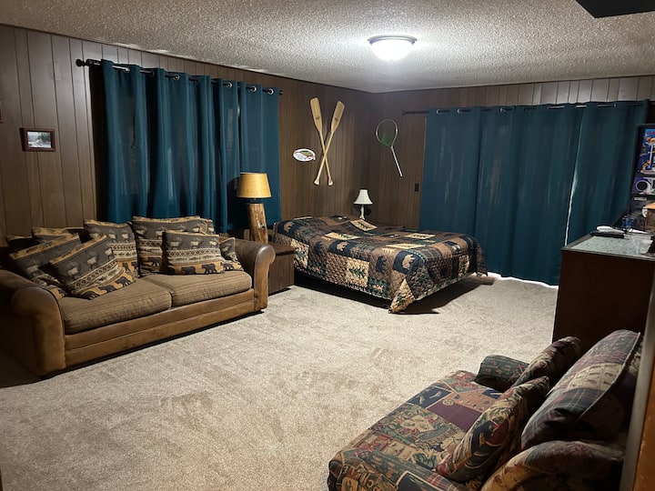 Bedroom upstairs with a pillow top queen mattress, couch and also a private deck off of this bedroom.