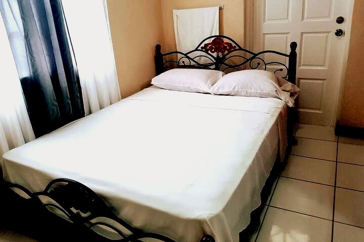 This is the third bedroom being shown in this photo. Queen sized bed as usual.

The door you see in the photo opens to a patio area. All bedrooms are on the second floor of the building.
Fully air conditioned. 