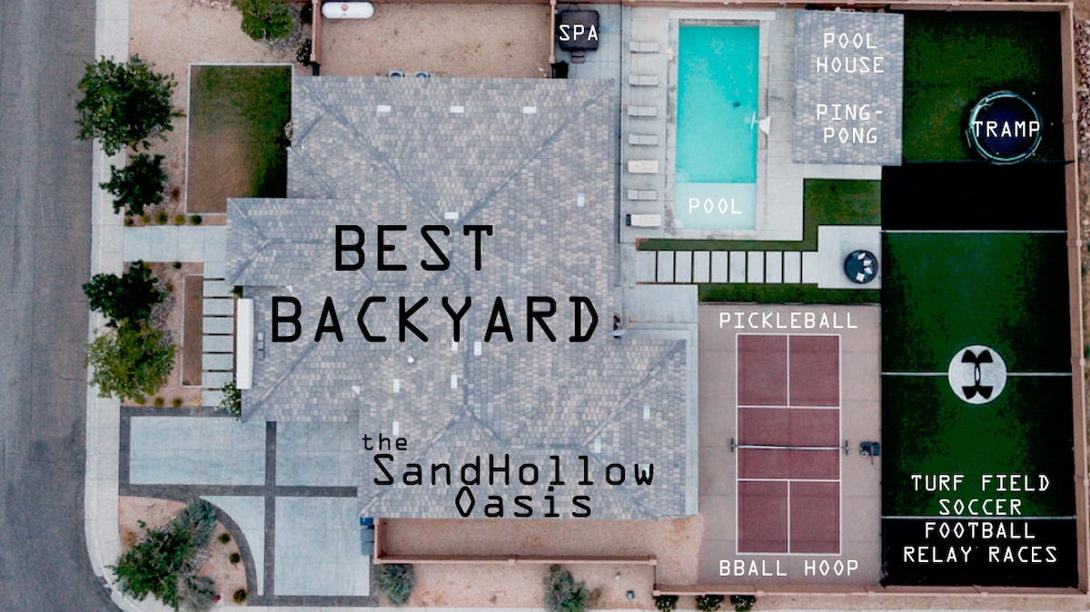 An aerial view showcases a spacious outdoor area, featuring a heated spa, pool house, and pool. Various sports amenities are visible, including pickleball and soccer fields, alongside a trampoline and ping-pong area. Clear signage highlights the activities available in this inviting backyard.