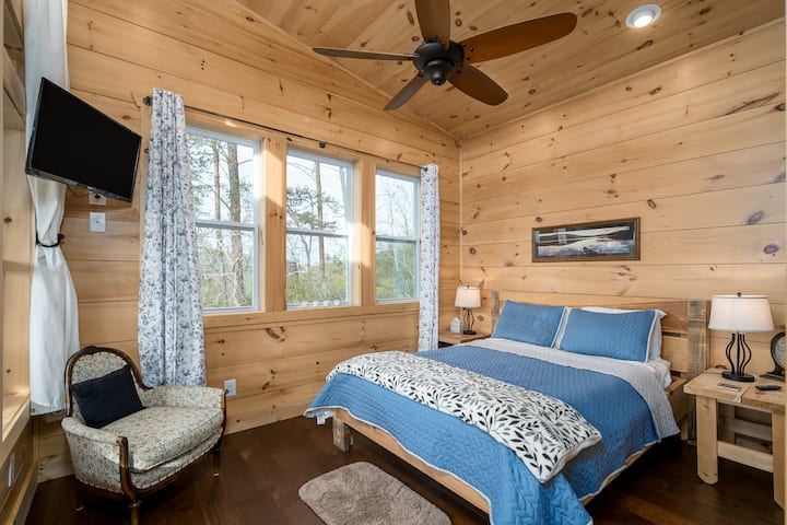 The main level queen has an exquisite view of the river.  Imaging waking up to this stunning view.