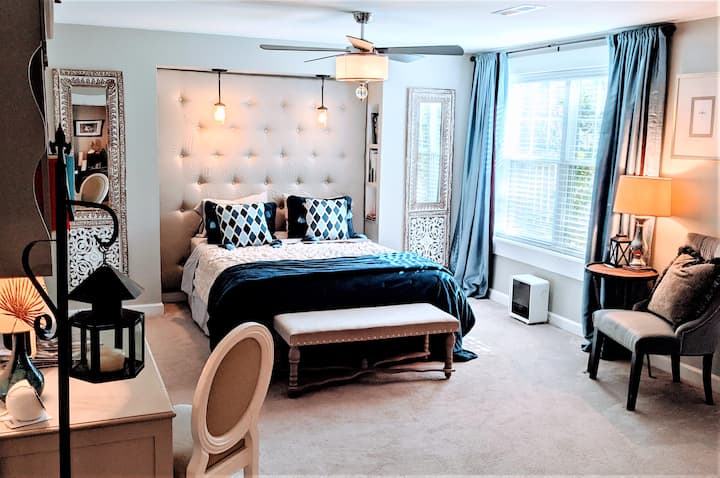 Queen sized bed and dressing table.