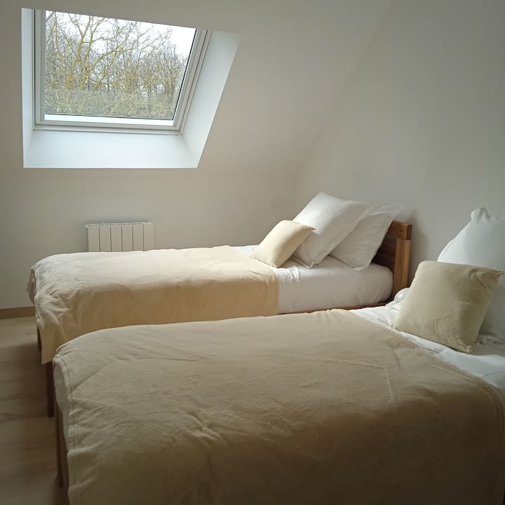 This room with soft colors has two beds, to be brought together as needed. For those who don't want to travel light, a dressing room is waiting for your suitcases. 
And if you want to work quietly, the bistro table converted into an office is there!