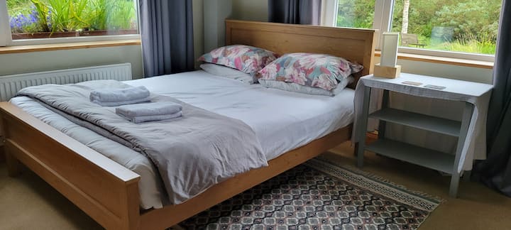 Room 4 downstairs king size bed plus cot and baby changing area