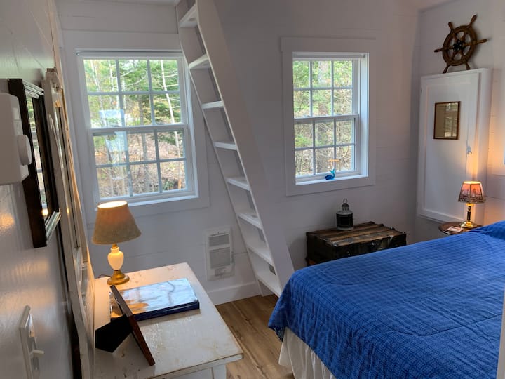 2nd bedroom with queen bed, ladder to loft with twin size mattress.  This bedroom has a stairway to a small loft with a twin mattress bed.