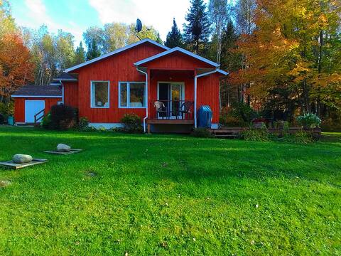 Warm chalet by the riverside Saint-Jean River