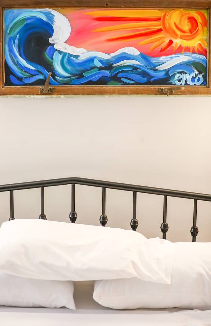 The primary bedroom features a comfortable king-size Tempur-Pedic bed. 