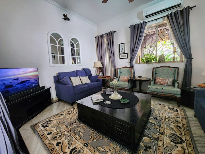 Living Room with Comfortable Seating and a High Definition Smart TV and a Surround Sound Home Theatre System for your Entertainment
