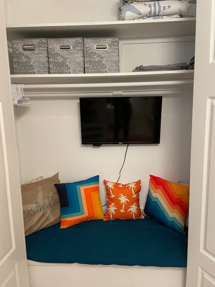 Reading nook and TV located in Bunkroom.