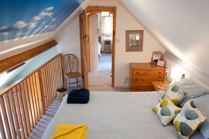 wake up to a blue sky every morning, in the galleried double bedroom