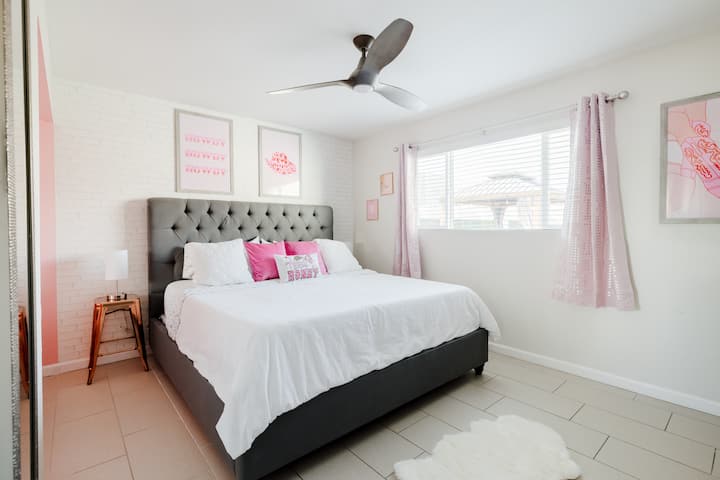 Master suite with king size bed, full length mirror, closet, & en suite bathroom.