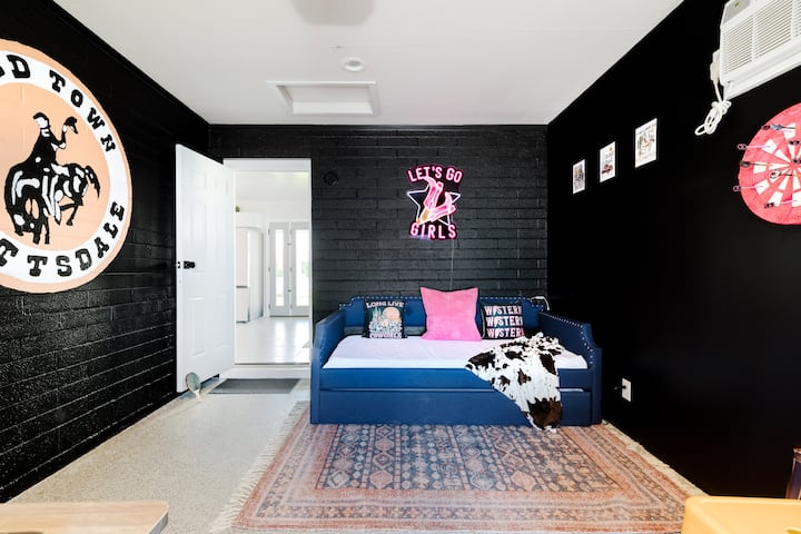 Air conditioned & heated (climate controlled) 4th bedroom is located in the garage/game room. Twin over twin trundle bed, wall mural, neon sign & much more! LET'S GO GIRLS!