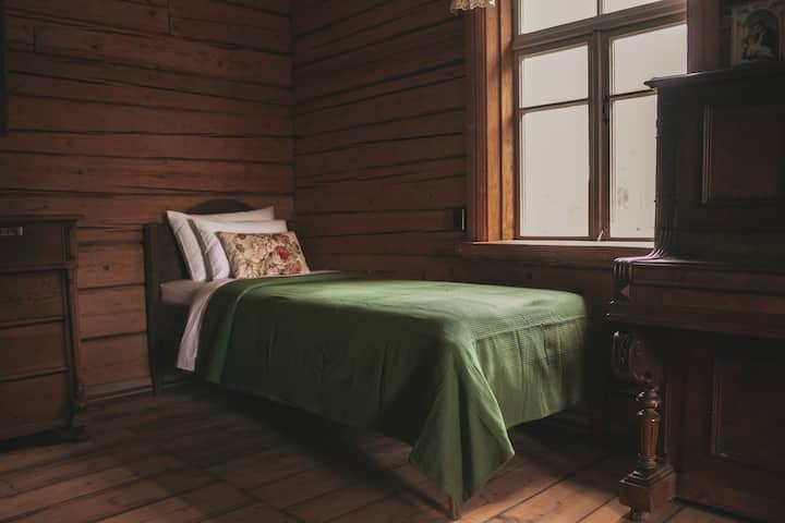 There are two beds (83x200cm) on the ground floor, made by the host themselves, taking one historical bedside table. 