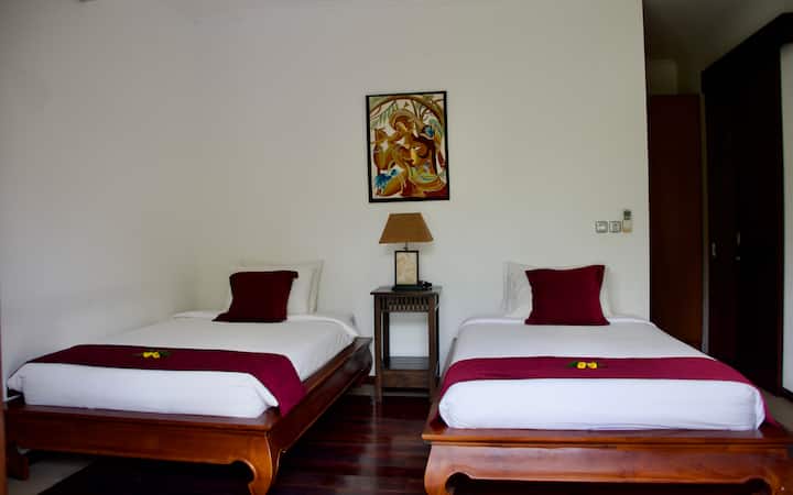 Bedroom 3. Ensuite with twin beds, spacious wardrobe area and work table.