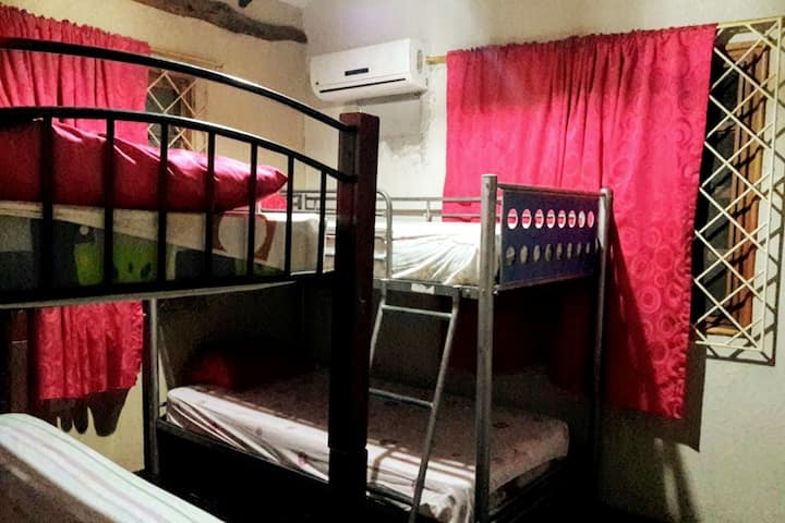 Bedroom with bunk beds and shared bathroom