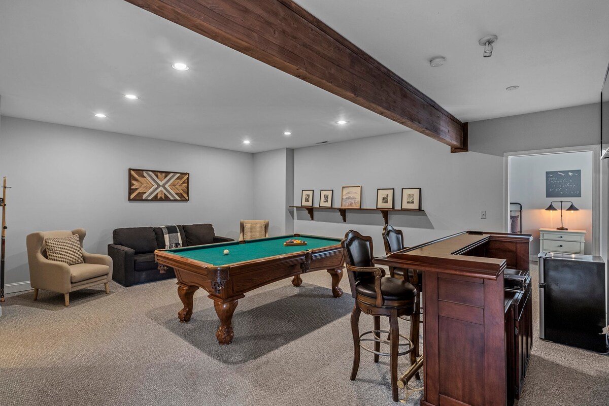 Pool table, bar, and pull out couch downstairs.