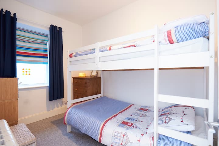 Children's Bedroom.  Top bunk suitable for older children only but not suitable for larger adults.