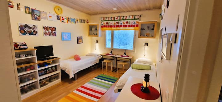 Bedroom with 2 beds, a lot of toys to play with.