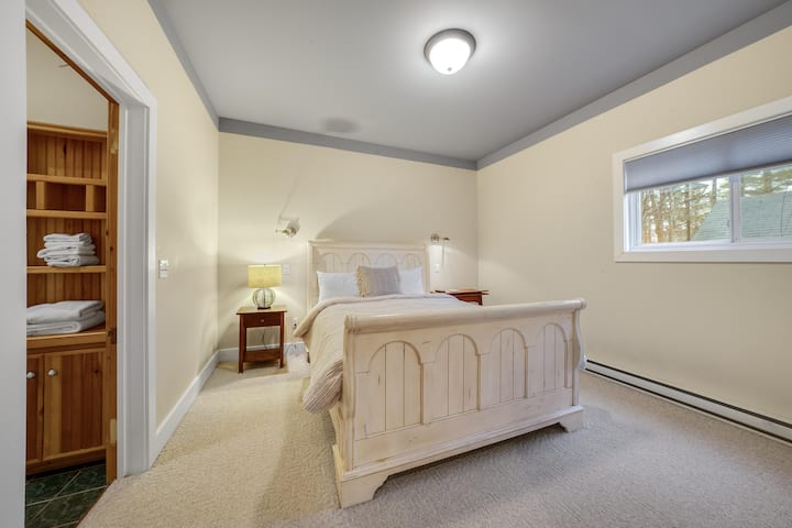 One of our two queen bedrooms, with a TV and attached full bathroom!