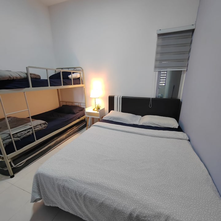 second bedroom with stand fan