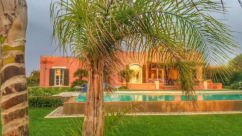 Light flooded Poolvilla embedded in vinyeards