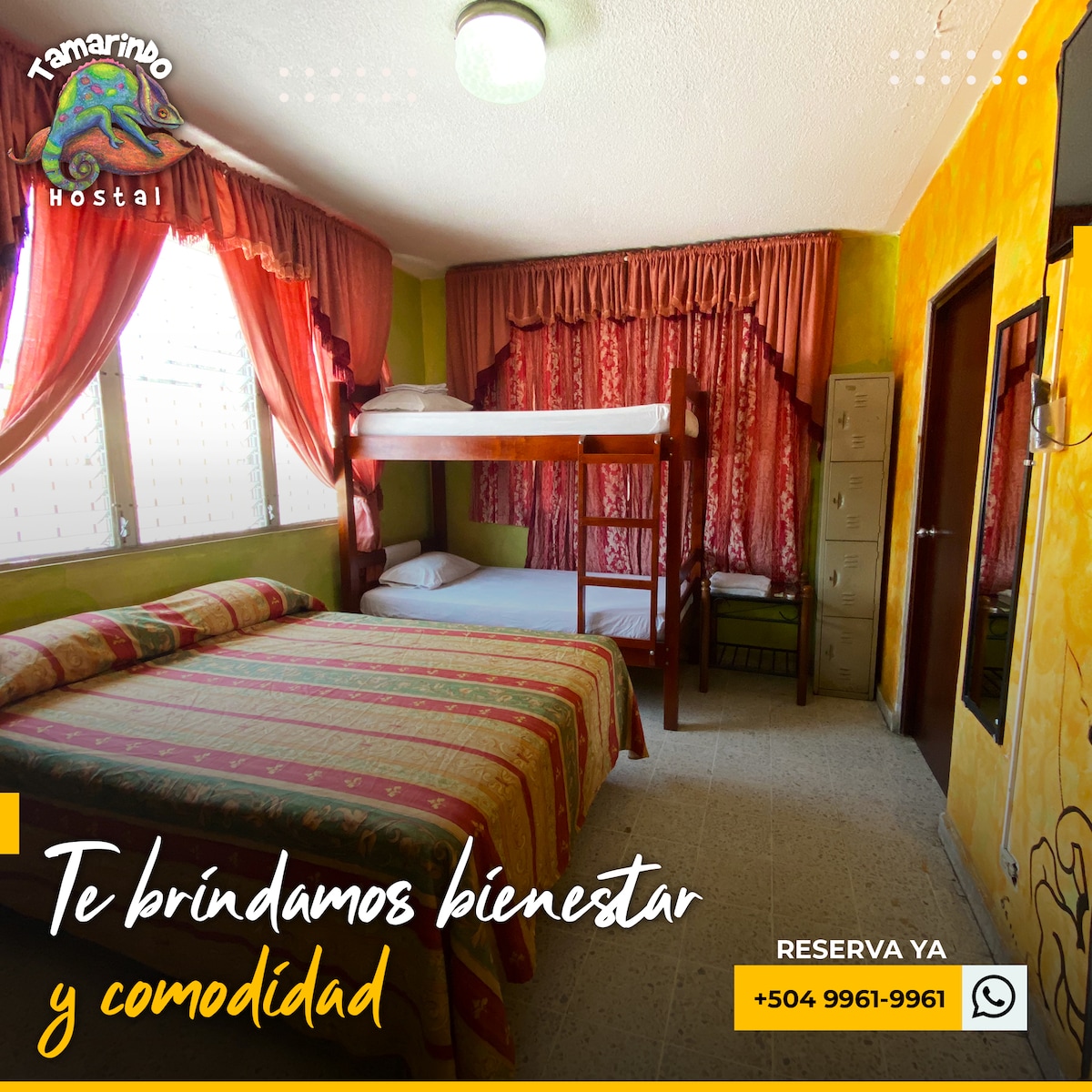 A well-lit bedroom features vibrant green walls and warm red curtains. Two beds are present, with one being a bunk bed. A spacious area is provided for movement, and personal lockers are seen against the wall, adding convenience for guests.