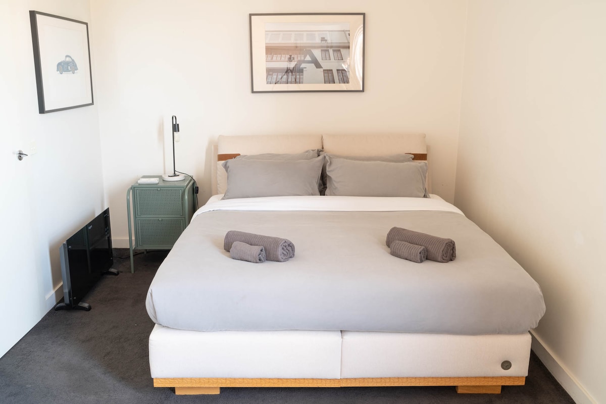 First bedroom with king size bed and full sized wardrobe. There is a portable travel cot for little ones. 