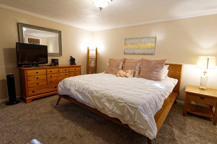 Downstairs bedroom with King bed, TV with FireStick, and it's own private deck.