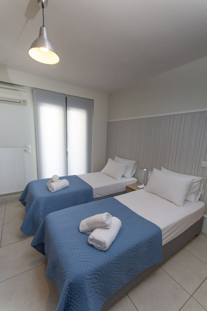 3rd bedroom. Set of towels provided for each guest and all bedrooms have bed lamps