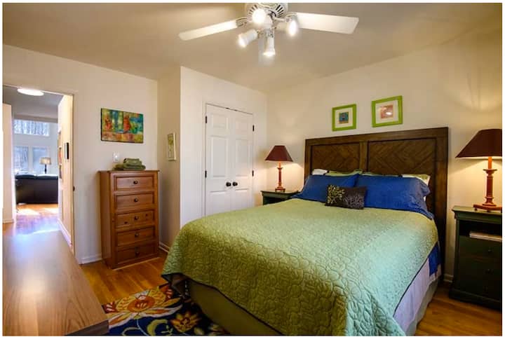 Ground floor bedroom with queen bed in the back of the A-frame. Hardwood floors. Dedicated work space with desk. Quietude.com