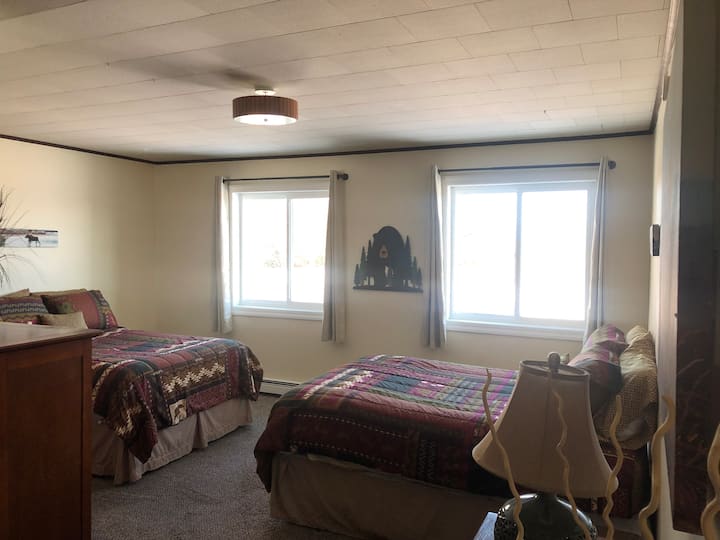 upstairs bedroom with 2 full beds; includes en suite bathroom