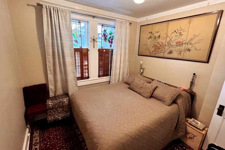 BR 2: Queen, stained glass, blackout curtains, plenty of closet space, and bench seat