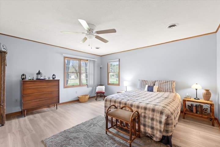 Master Bedroom with a Queen bed.   Note, there is also a queen airbed in the closet if needed  for guests numbering over seven.  The master bedroom floor space is big enough to accomodate the airbed if needed  for large parties.
