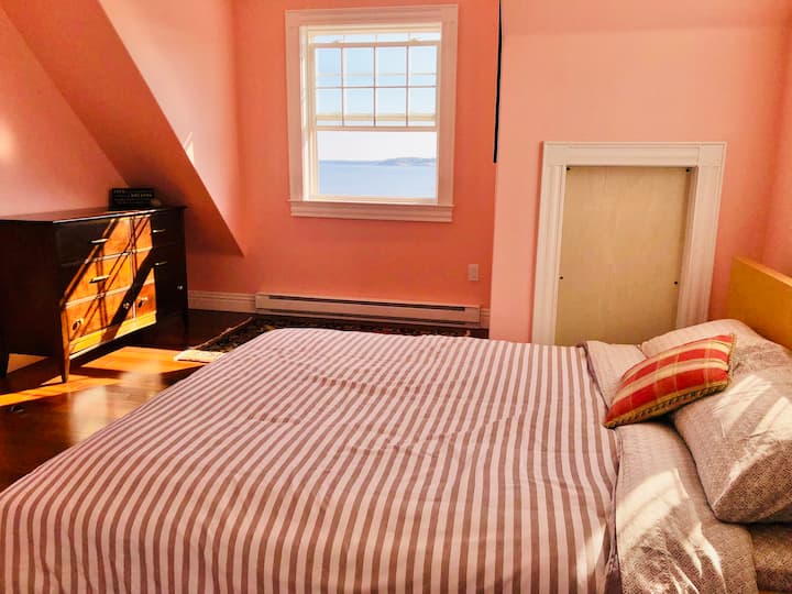 Crew bedroom #1 -  this room is on your left at the top of the stairs, faces the ocean, and has a low platform queen bed.