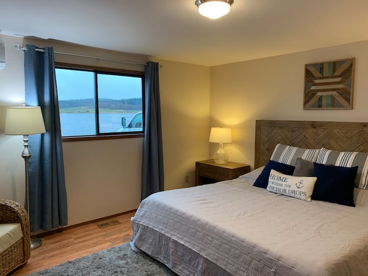 First bedroom with king sized bed and view of Swan Lake.