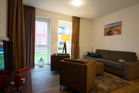 Successful Airbnb property: Apartment right on the ocean with pool and sauna in Kappeln
