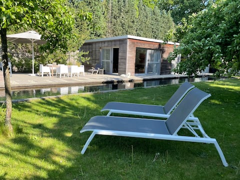 Stylish and spacious guesthouse with large swimming pond