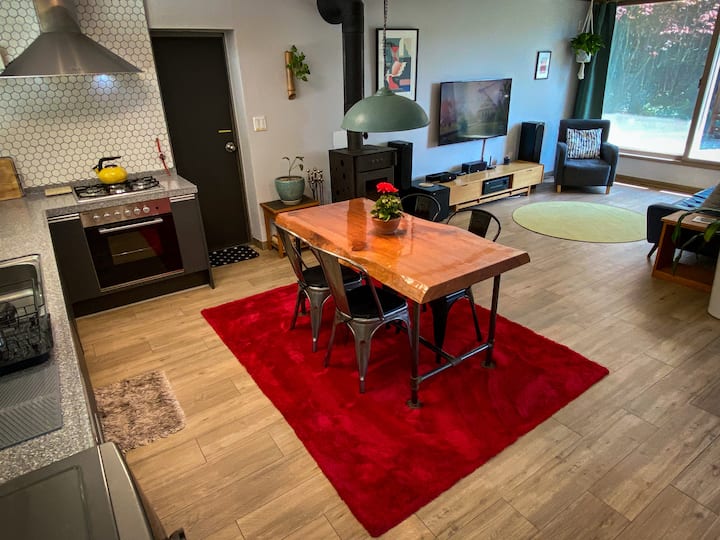 Open kitchen and living space.  Stereo and smart tv.  FULL SIZE OVEN and wood burning fireplace.  