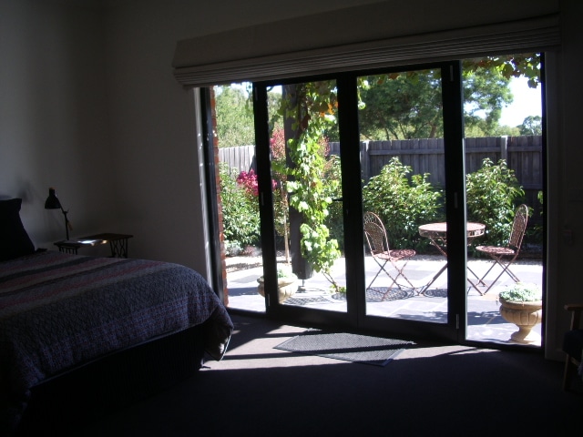 Large bedroom with private north facing patio and ensuite. 
