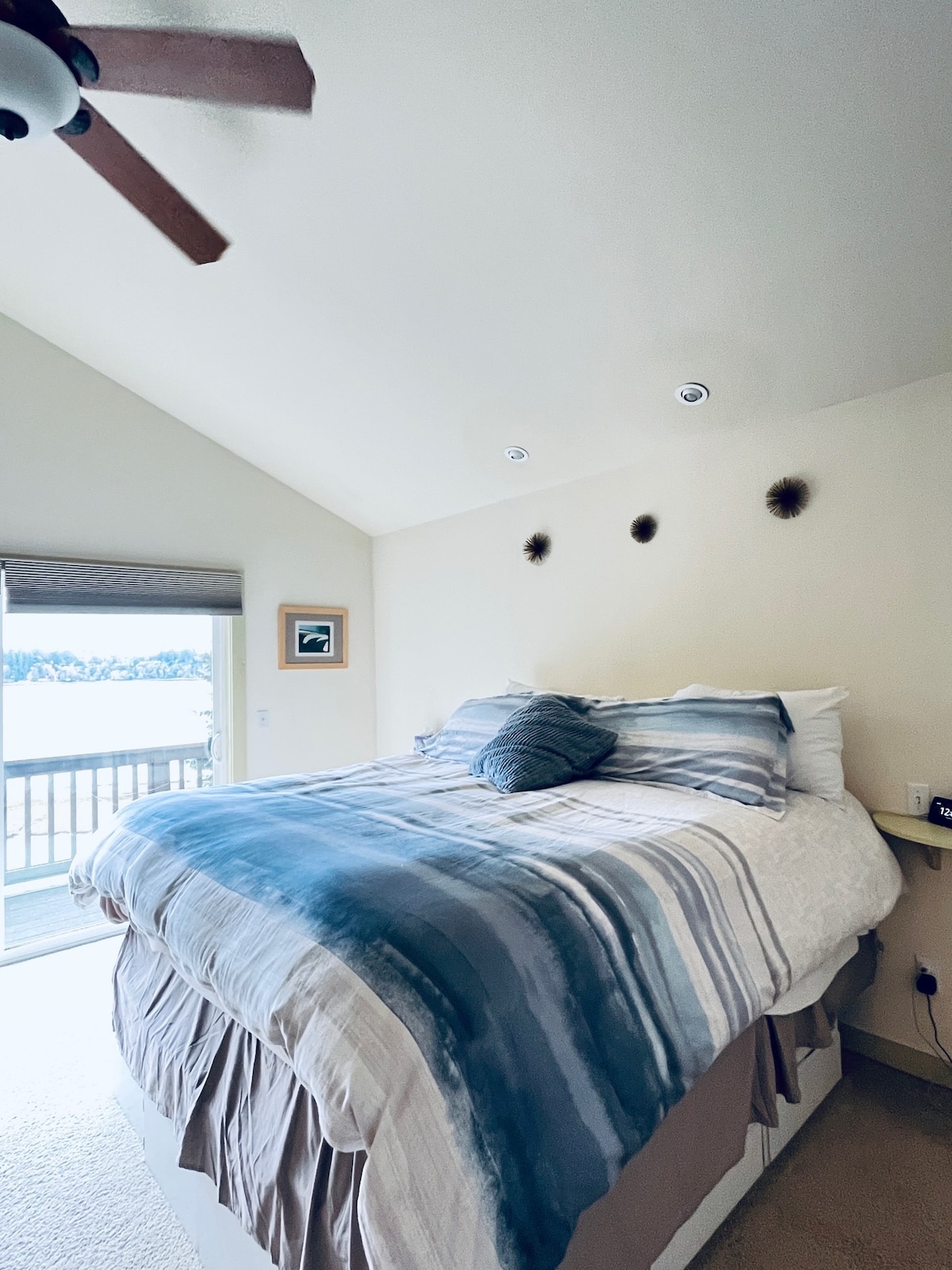 Main Bedroom.  Upstairs with private 3/4 bathroom.  Great Views of Puget Sound and Mount Rainier from attached deck. 